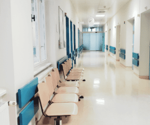Image of a vacant waiting room in a hospital showing many medical tests and appts with specialists when getting diagnosed with invisible illness. 