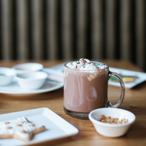 Image of hot chocolate with christmas cookies for migraine holiday season. 