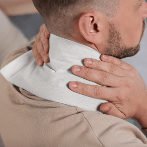 Image of wrapping heating pad for does heat help fibromyalgia. 