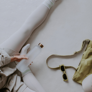 Woman with workout apparel for doing physical therapy and stretching for fibro symptoms. 