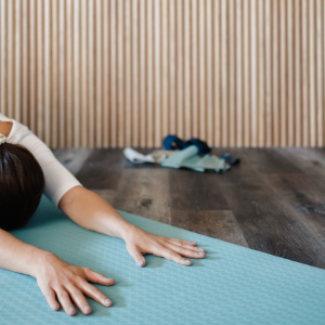 Image of a woman stretching as a way to relieve stress before a date. 