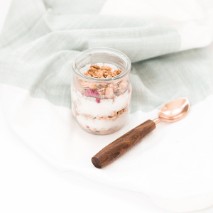 Image of a yogurt cup with granola and fruit for foods to eat with crohn’s disease