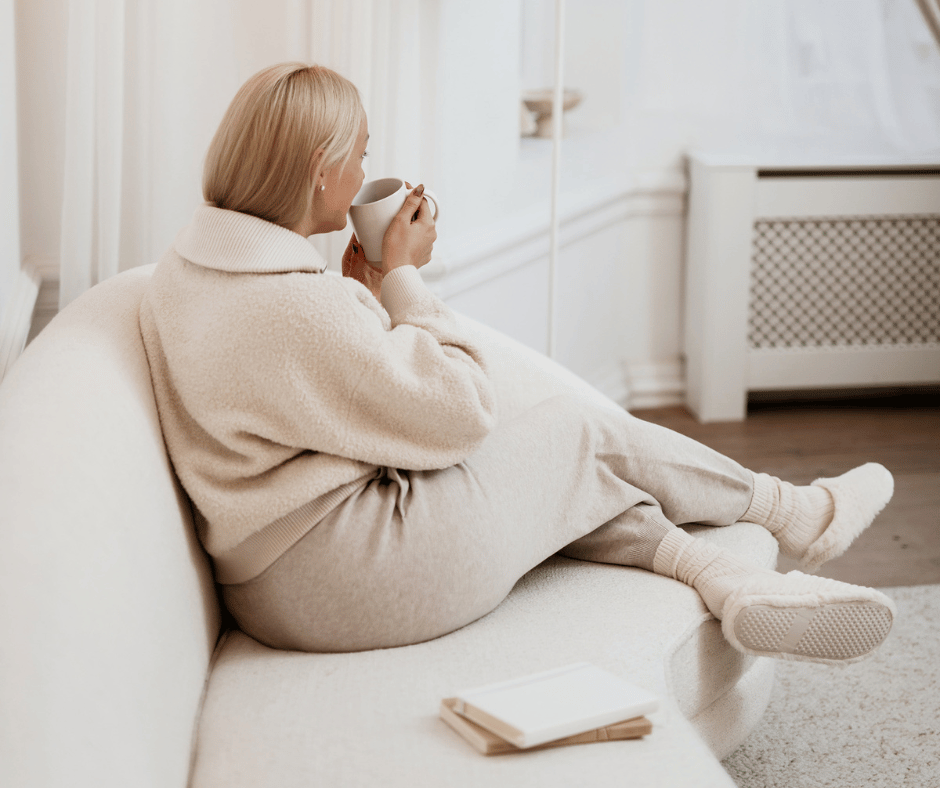 Image of woman getting cozy during a migraine showing alternatives to migraine medication. 